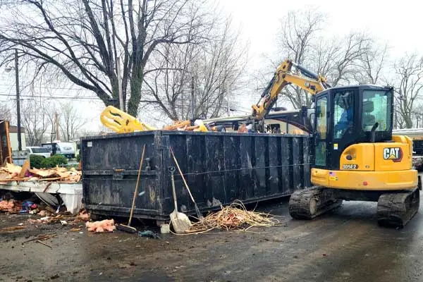 Debris removal with excavator and dumpster Debris removal with excavator and dumpster